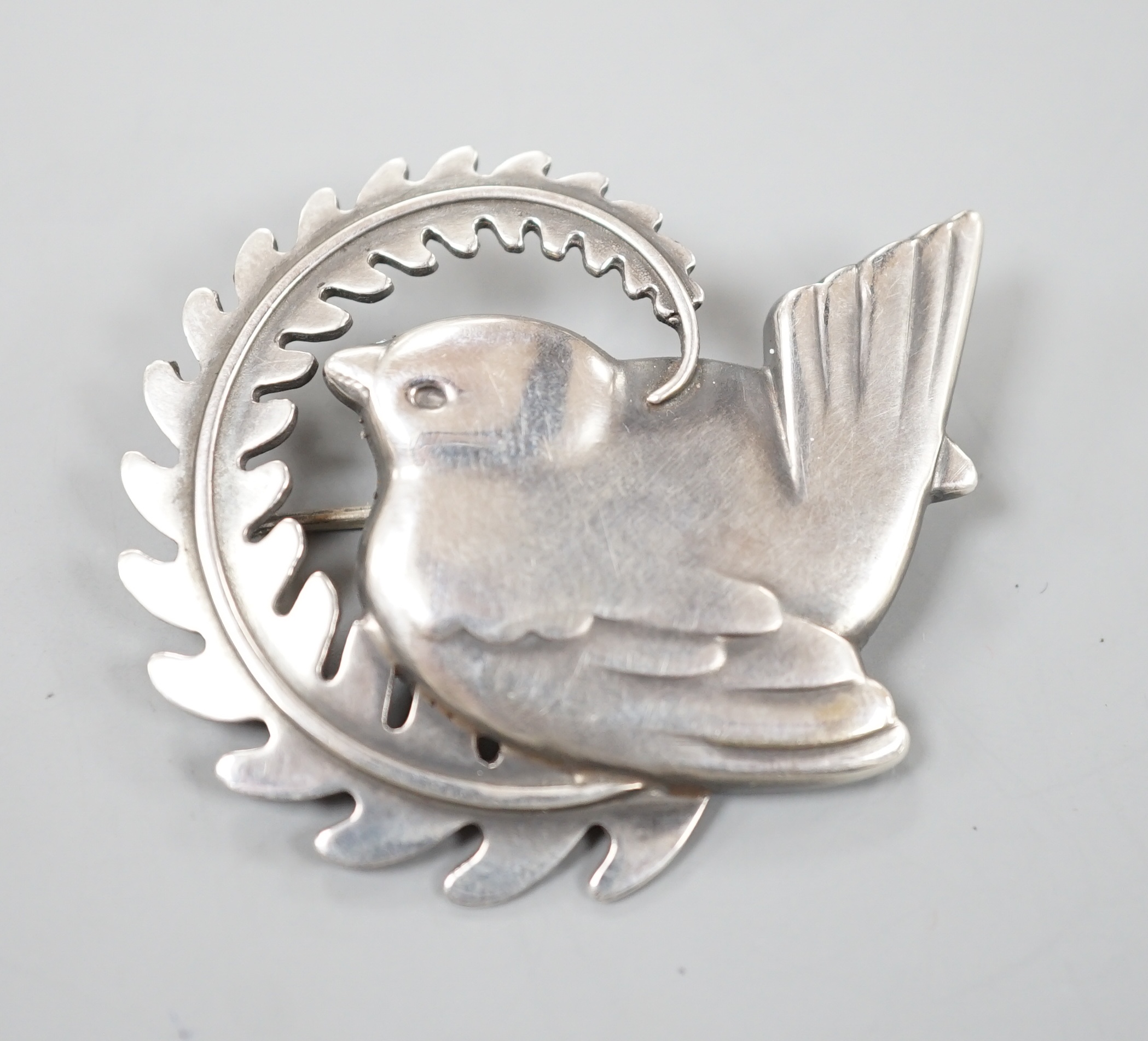 A Georg Jensen sterling 'robin with frond' brooch, no. 309, 49mm.
